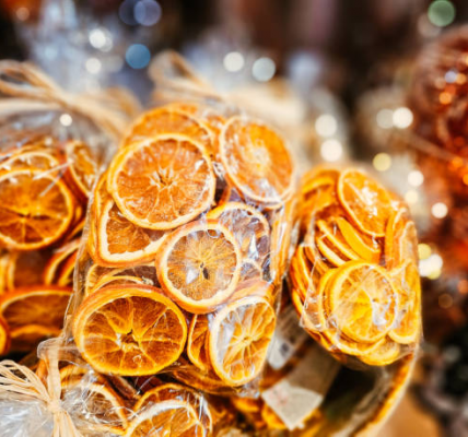 Step-by-step guide showing orange slices being dried in oven for decor