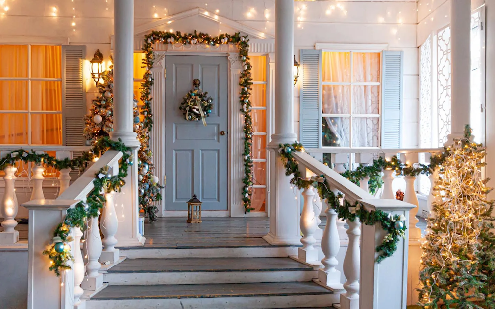 Elegant doorway with stylish wreath and hanging lanterns
