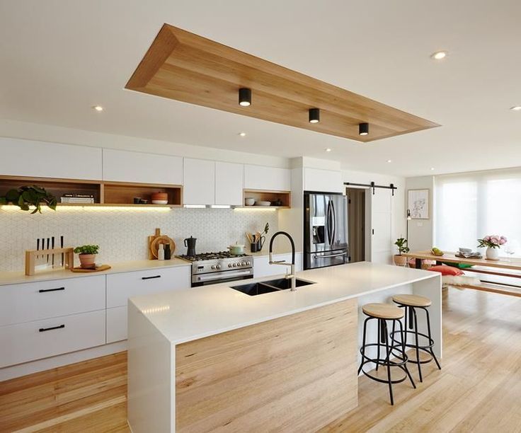 Sleek and efficient kitchen renovation - spacious countertop and bright lighting